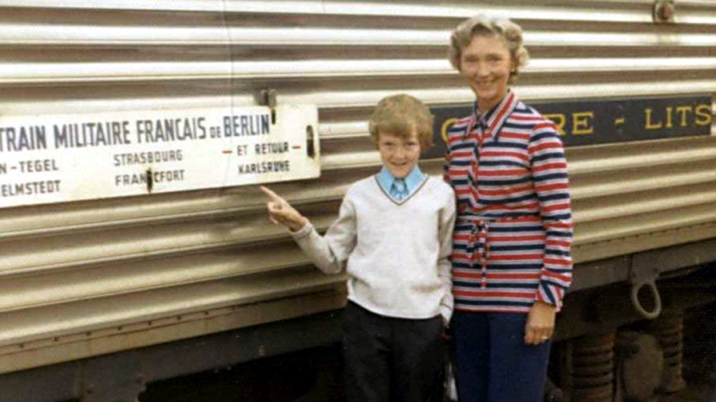 John und Maureen Schofield in front of a military train