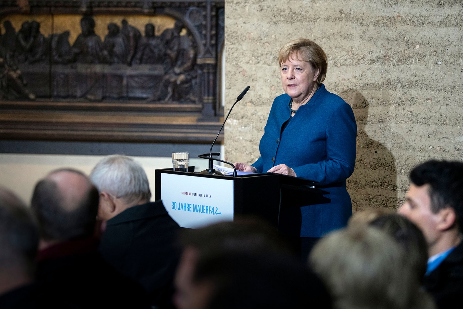 Angela Merkel behind a lectern